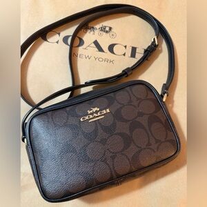 Coach Mini Jamie Camera Bag
In Signature Canvas Brown/Gold/Black.